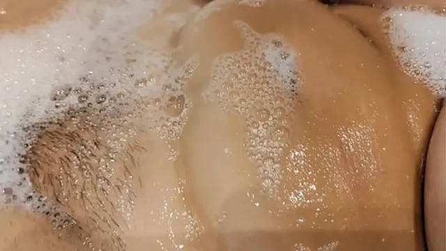 Tanned big tits girlfriend in bathroom playing with pussy and tits