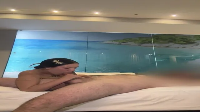 Petite brunette Olivia Quinn gives a sweaty blowjob and shows off her round ass